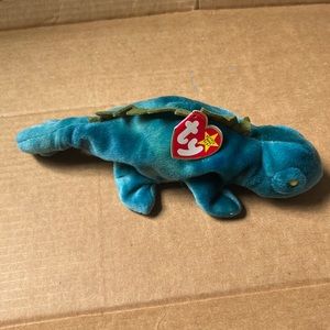 Ty beanie baby. Iguana “Iggy” Great condition. Tag still attached.